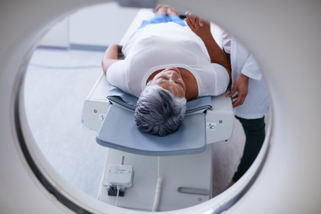 Shot of a senior woman being comforted by a doctor before and MRI scan